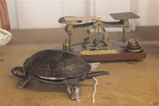 Metal tortoise table bell & a set of letter scales and weights